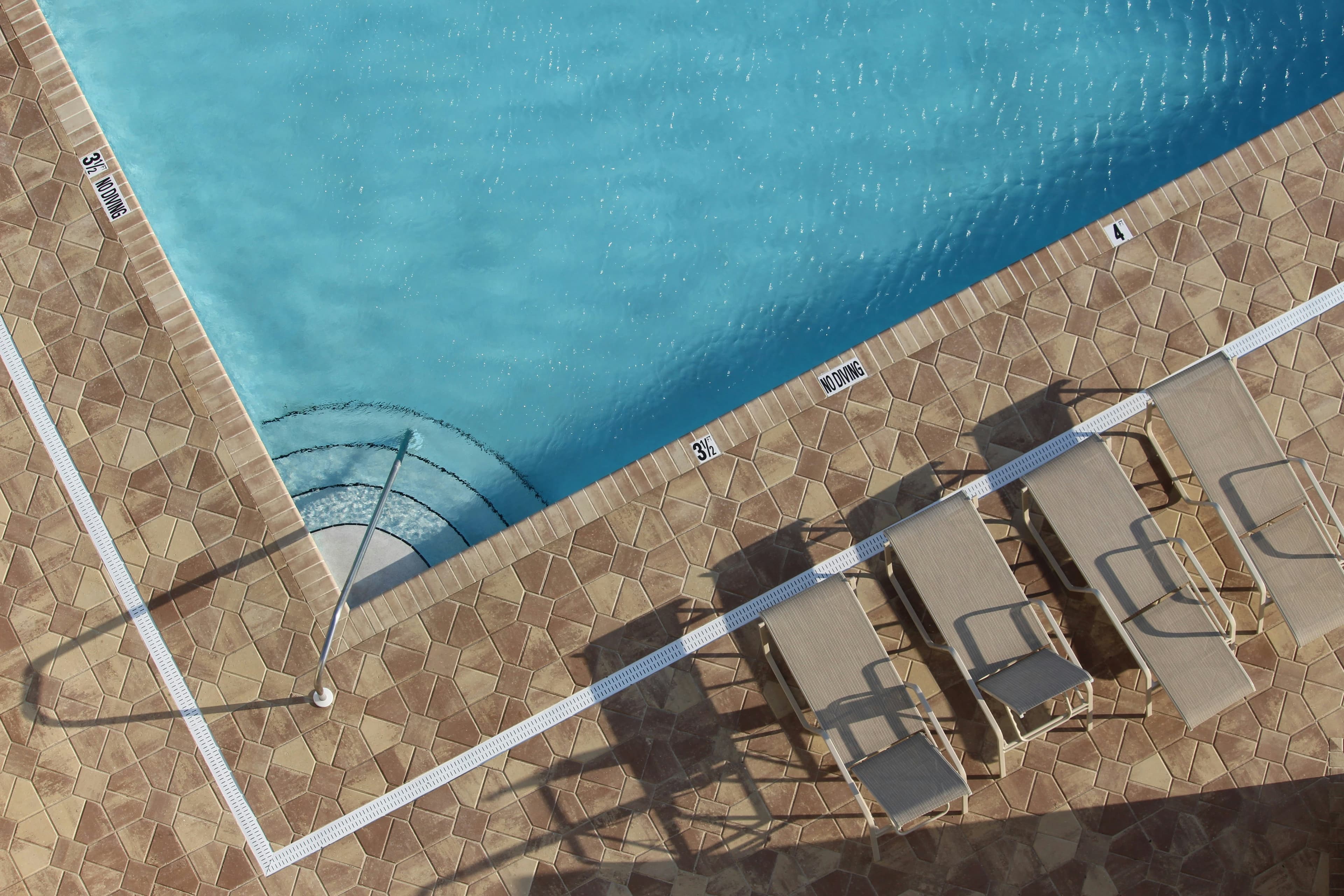 High-end pool deck with seamless tile installation