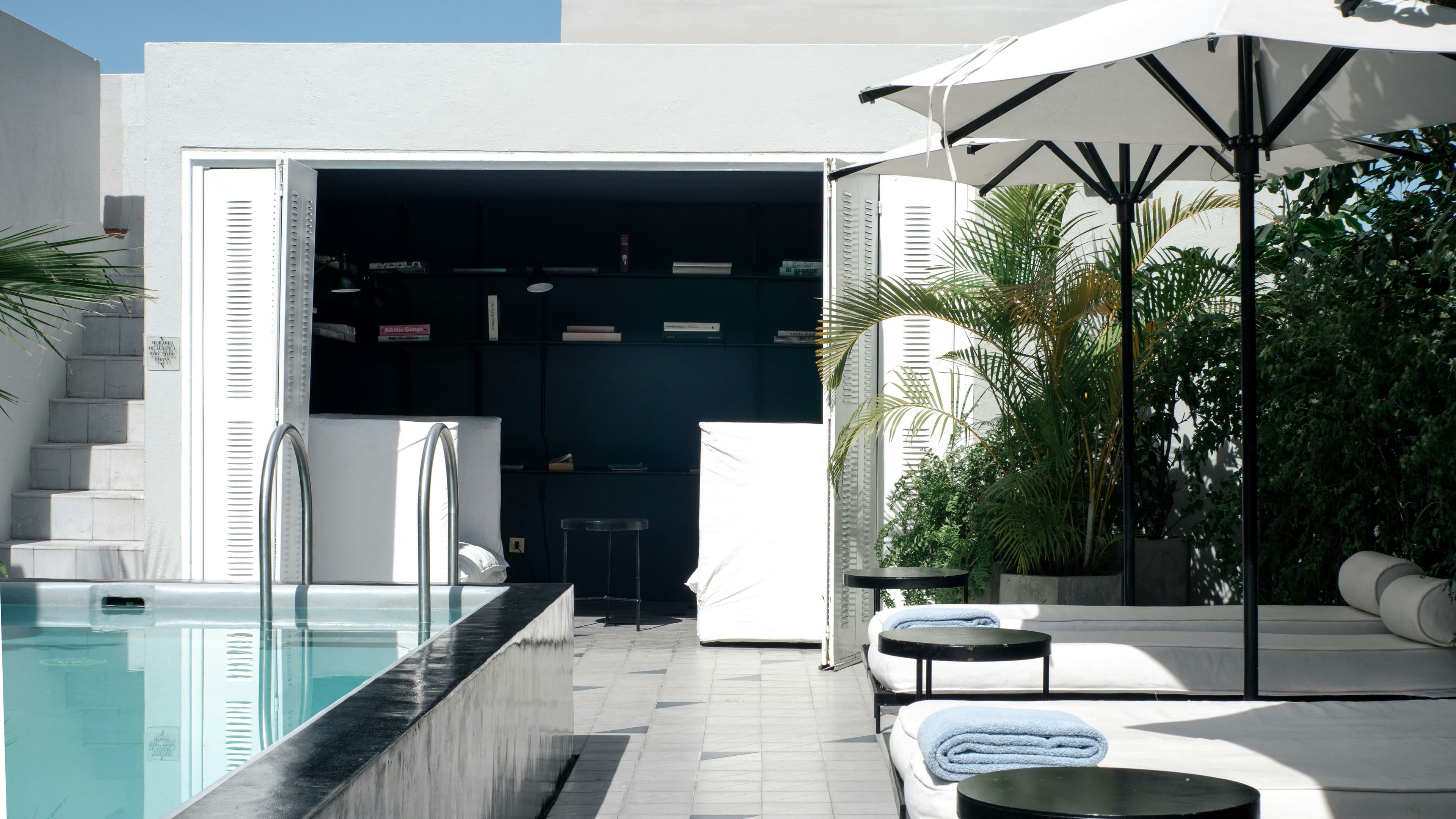 Modern luxury pool deck with premium stone tiles